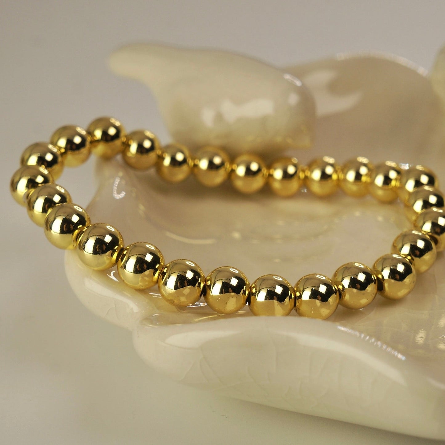 Pulsera enchape oro esferas