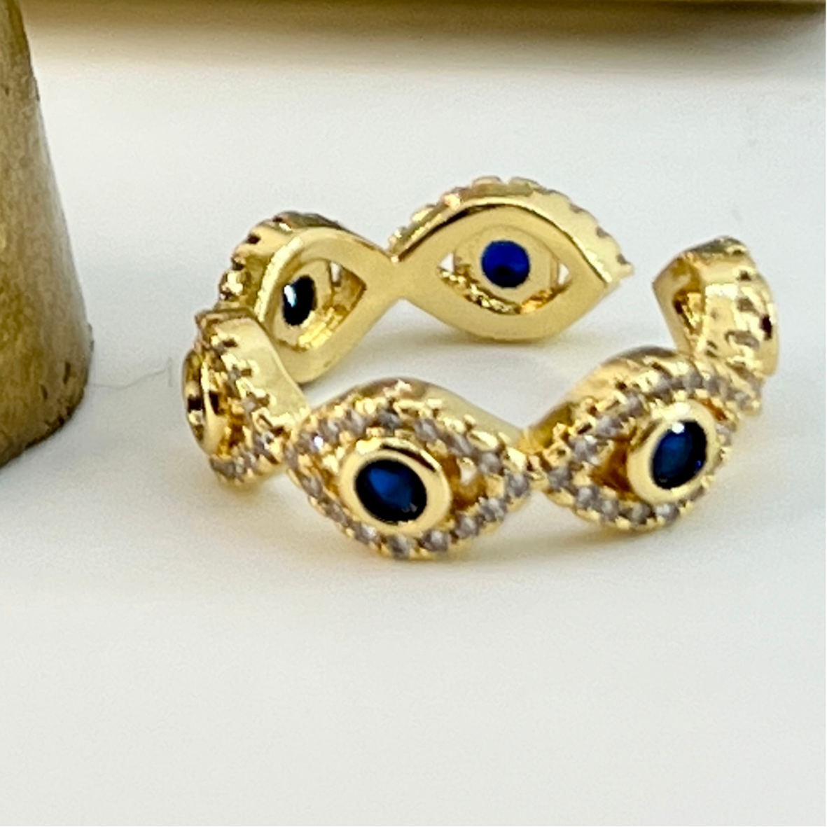 Anillo ojo turco enchape oro circón azul