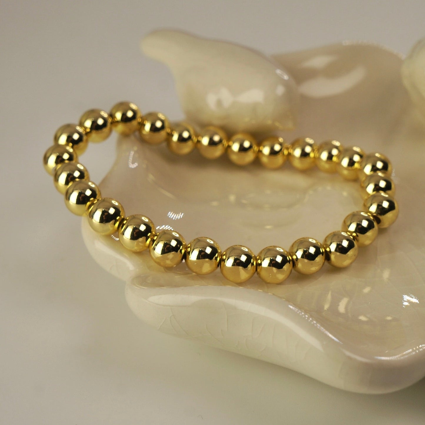 Pulsera enchape oro esferas