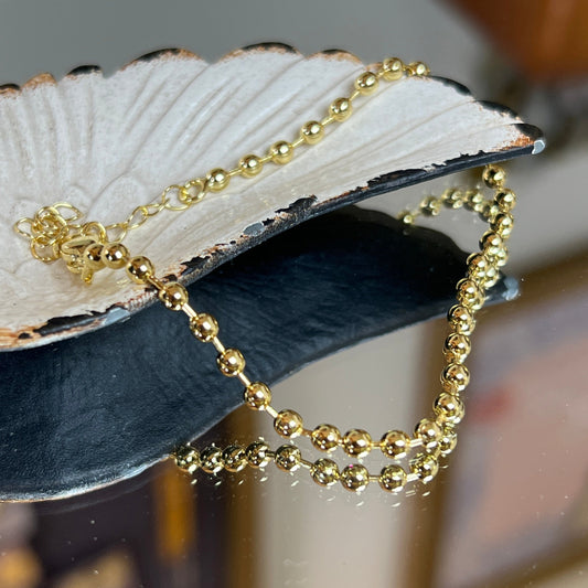 Pulsera bolitas enchape oro 18k